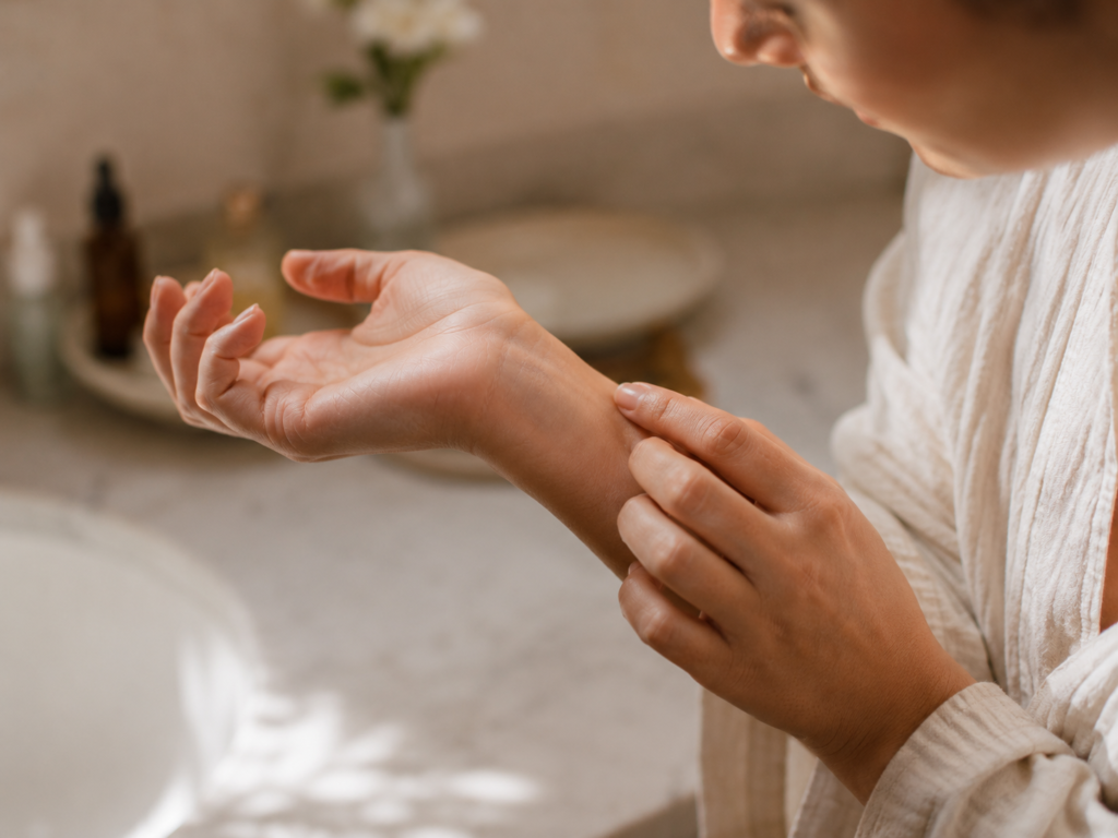 Person checking wrist after patch testing a new natural skincare product.