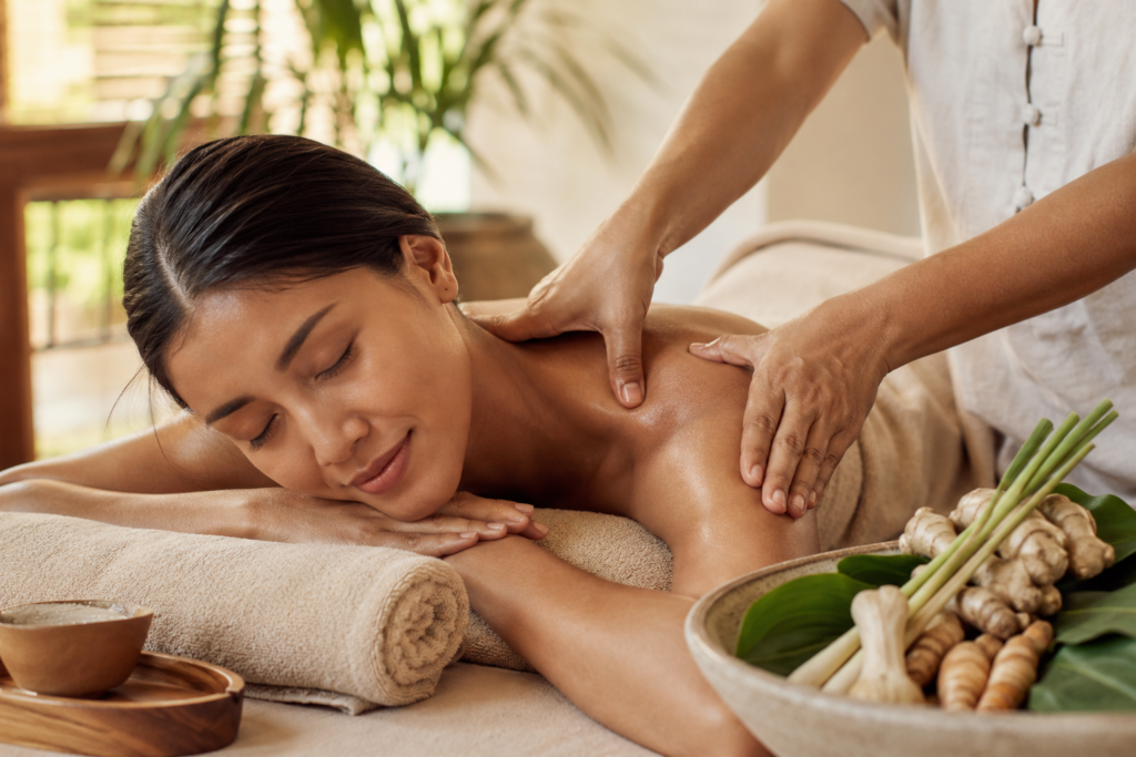 Gentle traditional wellness massage surrounded by natural botanicals in a calming space.